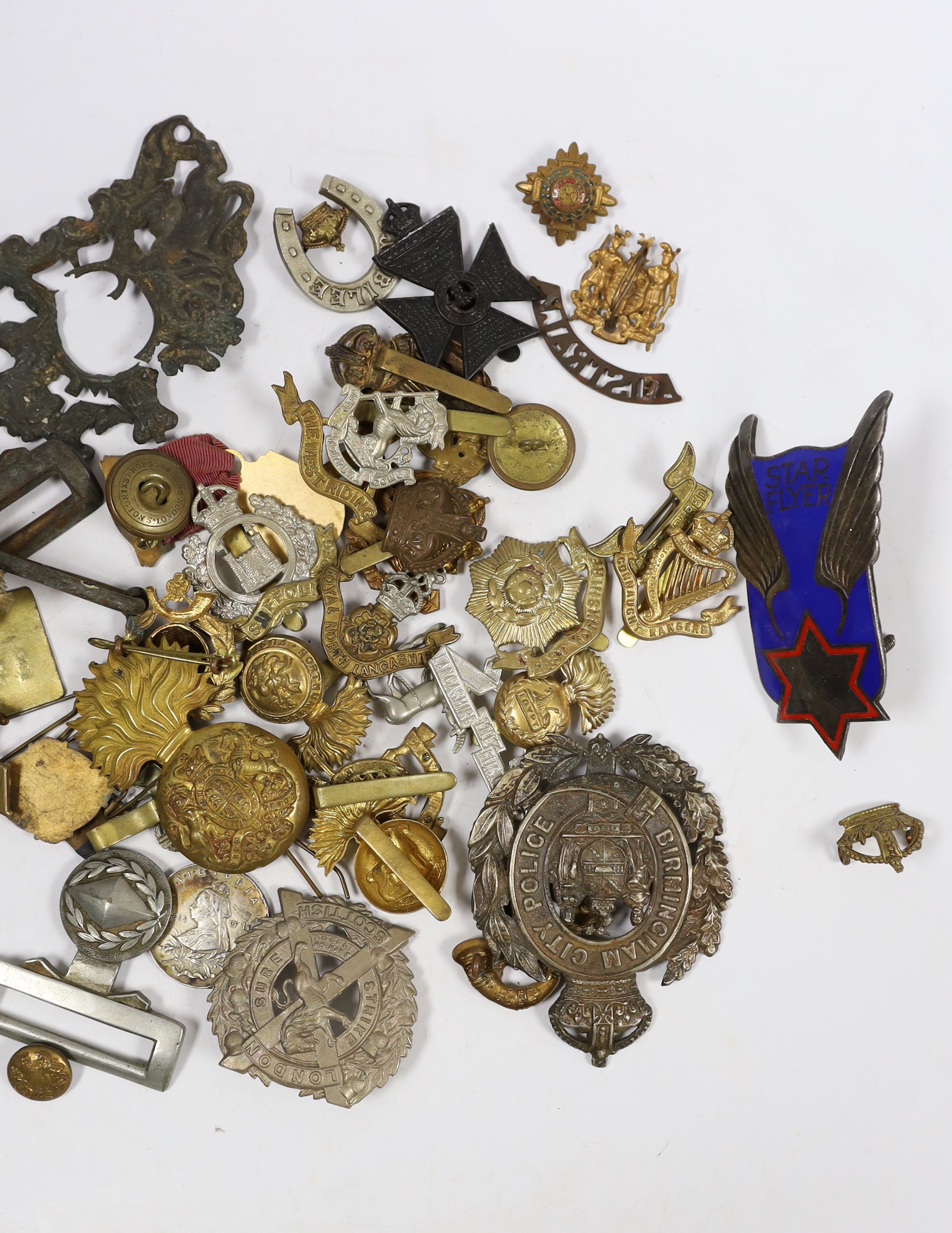 Eighteen military cap badges including Northumberland Fusiliers, East Yorkshire, SWB, the Suffolk Regiment, the Lancashire Fusiliers, Connaught Rangers, North Irish Horse, the West Riding, together with a number of shoul